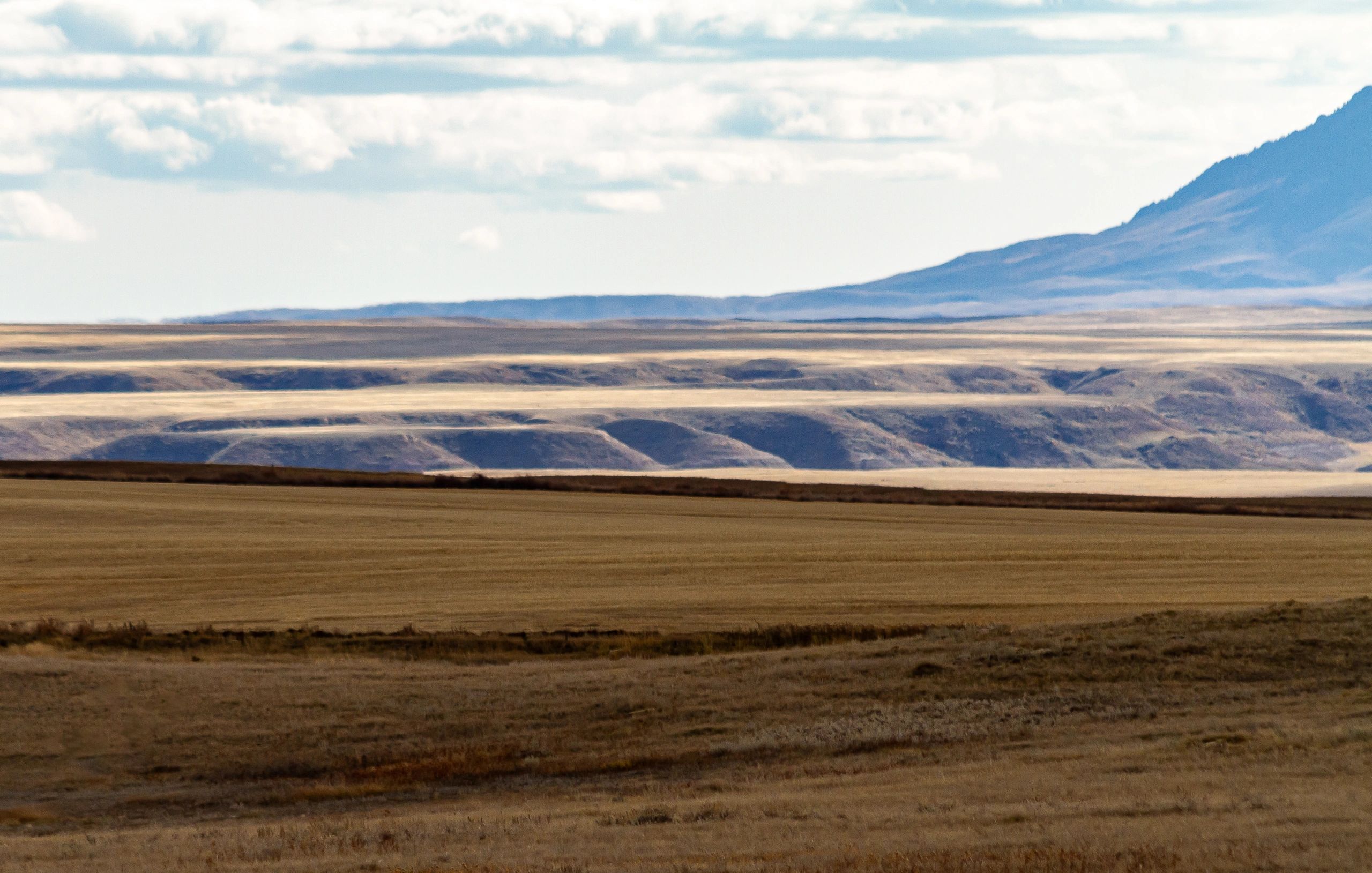Wide open Montana landscape with big sky and distant hills